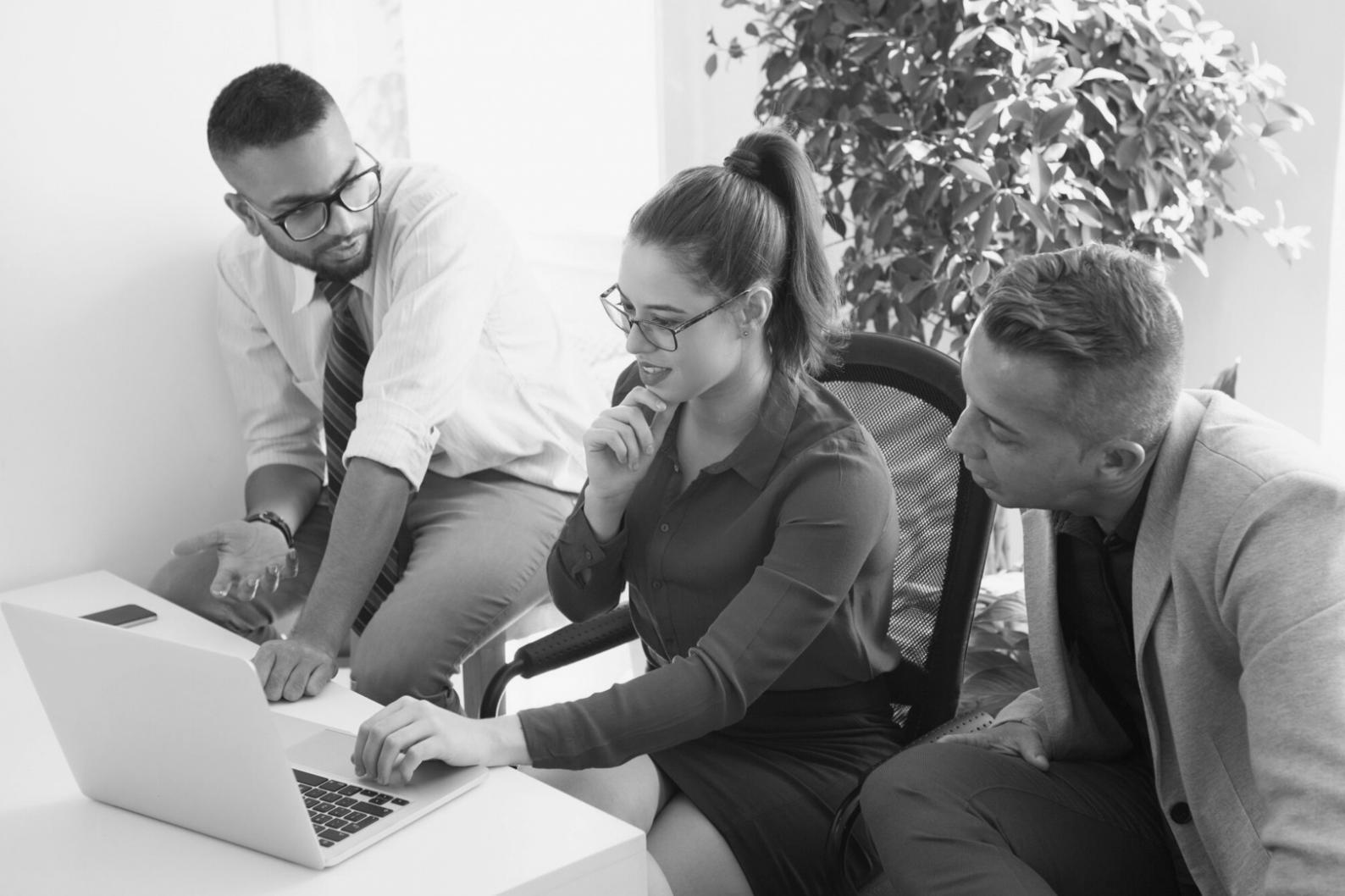 Person reviewing financial documents with organized budget sheets and expense tracking tools